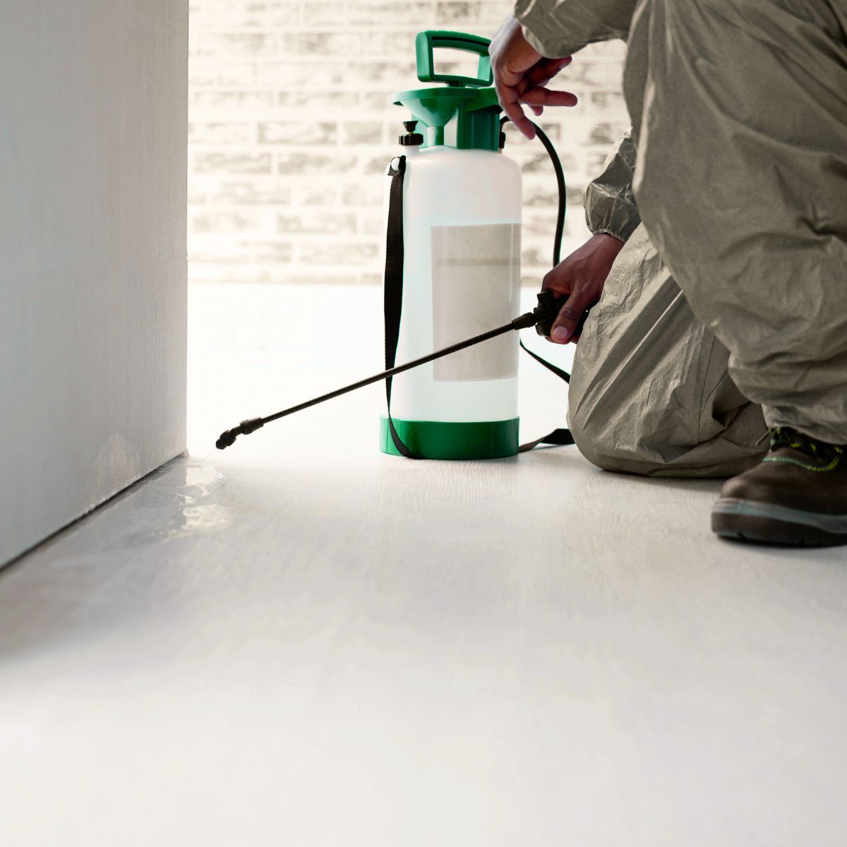 Technician performing indoor cockroach treatment service in Las Vegas